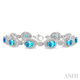 7X5 MM Oval Shape Blue Topaz and 1/10 Ctw Single Cut Diamond Semi-Precious Bracelet in Sterling Silver