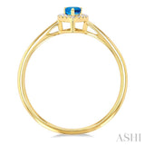 5x3 MM Pear Shape Blue Topaz and 1/20 Ctw Single Cut Diamond Halo Semi-Precious Ring in 10K Yellow Gold