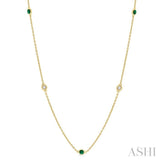 1.75 MM Emerald and 1/6 Ctw Round Cut Diamond Precious Station Necklace in 14K Yellow Gold